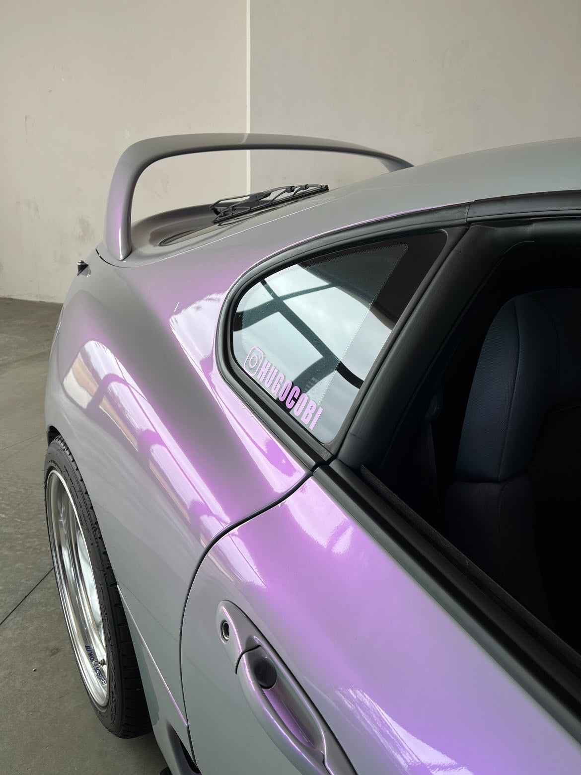 Custom social media decals on a car window, showcasing personalized styling and vibrant colors.